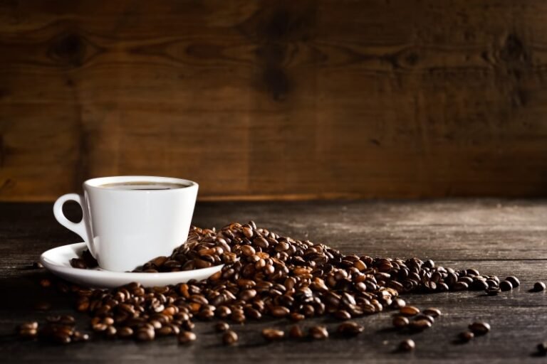 cup-coffee-with-pile-coffee-beans